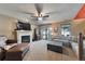 Open living room with fireplace, sliding glass doors and comfortable seating for entertaining guests at 293 Wagonwheel Dr, Fort Lupton, CO 80621