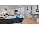 Entertainment room offers a comfortable seating area and a variety of musical instruments at 293 Wagonwheel Dr, Fort Lupton, CO 80621