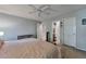 Tranquil main bedroom with ceiling fan and access to ensuite bathroom and closet for convenience at 293 Wagonwheel Dr, Fort Lupton, CO 80621