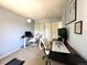 Bright office featuring dual workstations, a comfortable chair and a treadmill at 293 Wagonwheel Dr, Fort Lupton, CO 80621