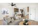 Cozy living room with modern furnishings and plenty of natural light, leading into an updated kitchen at 2295 S Sherman St, Denver, CO 80210