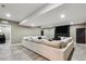 Spacious finished basement with a large sectional sofa and a modern fireplace at 39200 E 148Th Ct, Keenesburg, CO 80643