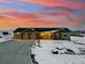 Well maintained ranch home with a three-car garage, rock accents, and mature landscaping at 39200 E 148Th Ct, Keenesburg, CO 80643