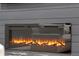 Electric fireplace with decorative logs and a sleek, modern design at 39200 E 148Th Ct, Keenesburg, CO 80643