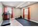 This home gym features a treadmill, rower and open space for exercise equipment and workout routines at 39200 E 148Th Ct, Keenesburg, CO 80643