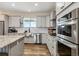 Well-equipped kitchen with stainless steel appliances, gray cabinets, and a granite countertop at 39200 E 148Th Ct, Keenesburg, CO 80643