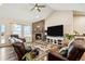 Comfortable living room with vaulted ceilings, stone fireplace, and lots of natural light at 39200 E 148Th Ct, Keenesburg, CO 80643
