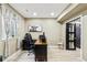 Bright home office featuring hardwood floors, natural light, a modern desk and a neutral color palette at 39200 E 148Th Ct, Keenesburg, CO 80643