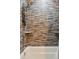 Beautifully tiled shower with sleek fixtures and built-in shelving at 39200 E 148Th Ct, Keenesburg, CO 80643