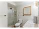 Cozy bathroom featuring a shower, toilet, sink, and mirror providing functionality at 620 S Alton Way # 5B, Denver, CO 80247