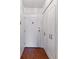 Hallway featuring a door and mirrored closet at 620 S Alton Way # 5B, Denver, CO 80247