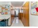 A hallway with storage lockers and community bulletin boards create an organized and accessible shared space at 620 S Alton Way # 5B, Denver, CO 80247