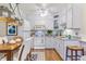 Well-lit kitchen equipped with modern appliances and a dining table at 620 S Alton Way # 5B, Denver, CO 80247