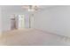 Spacious main bedroom with neutral tones, carpet, and access to the ensuite bathroom and closet at 620 S Alton Way # 5B, Denver, CO 80247