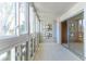 Bright sunroom with large windows providing ample natural light and access to the main living space, ideal for relaxation at 620 S Alton Way # 5B, Denver, CO 80247