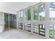 Bright sunroom featuring floor-to-ceiling windows with tree views at 620 S Alton Way # 5B, Denver, CO 80247