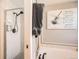 Bathroom featuring walk-in shower, soaking tub with stylish dragonfly wall art at 5490 S Jellison St, Littleton, CO 80123