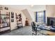 Well lit bedroom with a desk, chair and window with view of the outside. Shelf unit with books and accessories at 5490 S Jellison St, Littleton, CO 80123