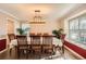 Elegant dining room featuring a large table with seating, a window, and natural light at 5490 S Jellison St, Littleton, CO 80123