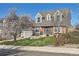 Lovely two-story brick home featuring a well-kept lawn and charming curb appeal in the daytime at 5490 S Jellison St, Littleton, CO 80123