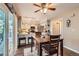 Eat-in kitchen area with stainless steel appliances, granite counters, access to the backyard, and a breakfast bar at 5490 S Jellison St, Littleton, CO 80123