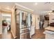 Kitchen boasts stainless steel refrigerator, granite countertops, and convenient access to dining and living areas at 5490 S Jellison St, Littleton, CO 80123
