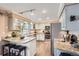 Well-equipped kitchen featuring granite countertops, stainless steel appliances, and updated cabinetry at 5490 S Jellison St, Littleton, CO 80123