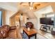 Spacious living room with hardwood floors, ceiling fan, and comfortable seating at 5490 S Jellison St, Littleton, CO 80123