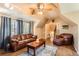 Cozy living room features hardwood floors, comfortable seating, and ample natural light at 5490 S Jellison St, Littleton, CO 80123