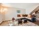 Cozy living room with stylish furniture, warm lighting, and staircase at 5490 S Jellison St, Littleton, CO 80123