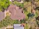 Aerial view showcases the roof, surrounding mature trees, well-manicured lawn and landscaping at 12362 E Vassar Dr, Aurora, CO 80014