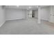 Finished carpeted basement with storage closets, a mirrored wall, and staircase at 12362 E Vassar Dr, Aurora, CO 80014