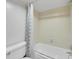 Modest bathroom with a toilet and tiled shower-tub combo at 12362 E Vassar Dr, Aurora, CO 80014