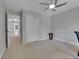 Neutral bedroom features plush carpet, closet, and a ceiling fan at 12362 E Vassar Dr, Aurora, CO 80014