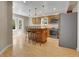 Eat-in kitchen features stainless steel appliances, a center island, and pendant lighting at 12362 E Vassar Dr, Aurora, CO 80014
