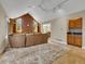 Bright living room boasts a brick fireplace, custom built-ins, and a wet bar at 12362 E Vassar Dr, Aurora, CO 80014