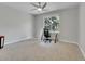 Bright office featuring carpet, neutral walls, a ceiling fan, and a desk area at 12362 E Vassar Dr, Aurora, CO 80014