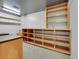 Large storage area with shelving, utility lighting, and counter space at 12362 E Vassar Dr, Aurora, CO 80014