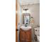 Charming powder room with a pedestal sink and modern fixtures at 6836 Edgewood Way, Highlands Ranch, CO 80130