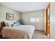 Cozy bedroom featuring a bed, a window, and carpet flooring at 6836 Edgewood Way, Highlands Ranch, CO 80130