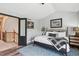 Cozy bedroom with accent wall, ample natural light, and hardwood flooring at 6836 Edgewood Way, Highlands Ranch, CO 80130