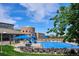 Community pool with ample lounge seating, water slides, and a clubhouse on a clear day at 6836 Edgewood Way, Highlands Ranch, CO 80130