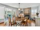 Cozy dining area with decorative fireplace, stylish furniture, and sliding doors at 6836 Edgewood Way, Highlands Ranch, CO 80130