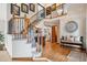 Spacious foyer with staircase, wood floors and decor at 6836 Edgewood Way, Highlands Ranch, CO 80130