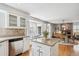 Stylish kitchen with granite countertops, modern appliances, and adjacent dining area at 6836 Edgewood Way, Highlands Ranch, CO 80130