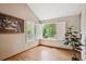 Bright room with hardwood flooring, shuttered windows, and natural light at 6836 Edgewood Way, Highlands Ranch, CO 80130