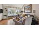 Cozy living room featuring built-in shelves, a window seat, and stylish decor at 6836 Edgewood Way, Highlands Ranch, CO 80130