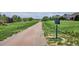 Scenic walking trail alongside well maintained grassy knoll and neighborhood homes at 6836 Edgewood Way, Highlands Ranch, CO 80130