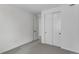 Bright bedroom with neutral carpet, closet, and white paint at 1422 Hudson Pl, Longmont, CO 80501