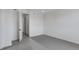 Bedroom with an open doorway, featuring clean carpeting and an abundance of light at 1422 Hudson Pl, Longmont, CO 80501